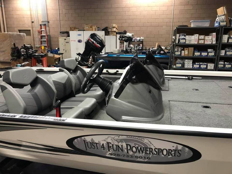 A boat with two seats in the back of it.