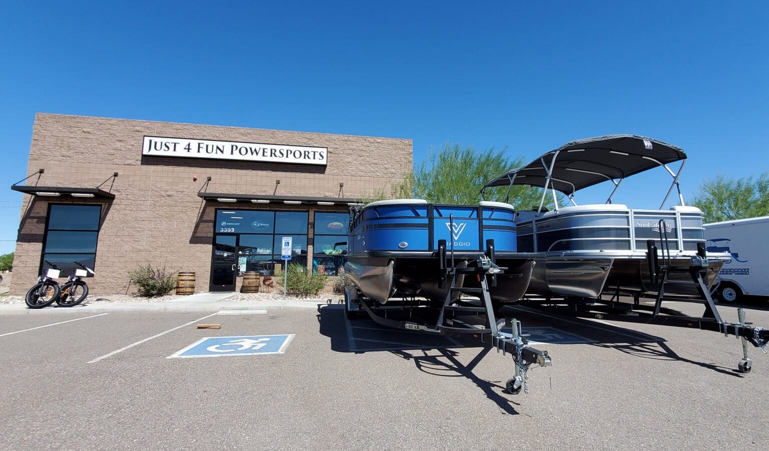 A boat is parked in front of a building.